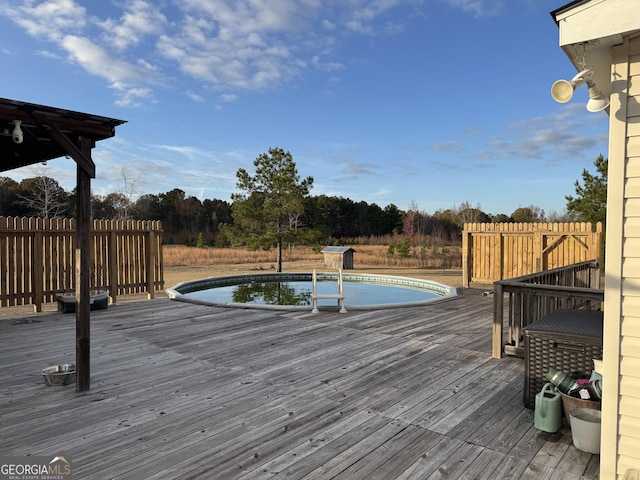 view of swimming pool with a wooden deck