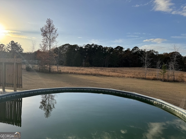 view of pool at dusk