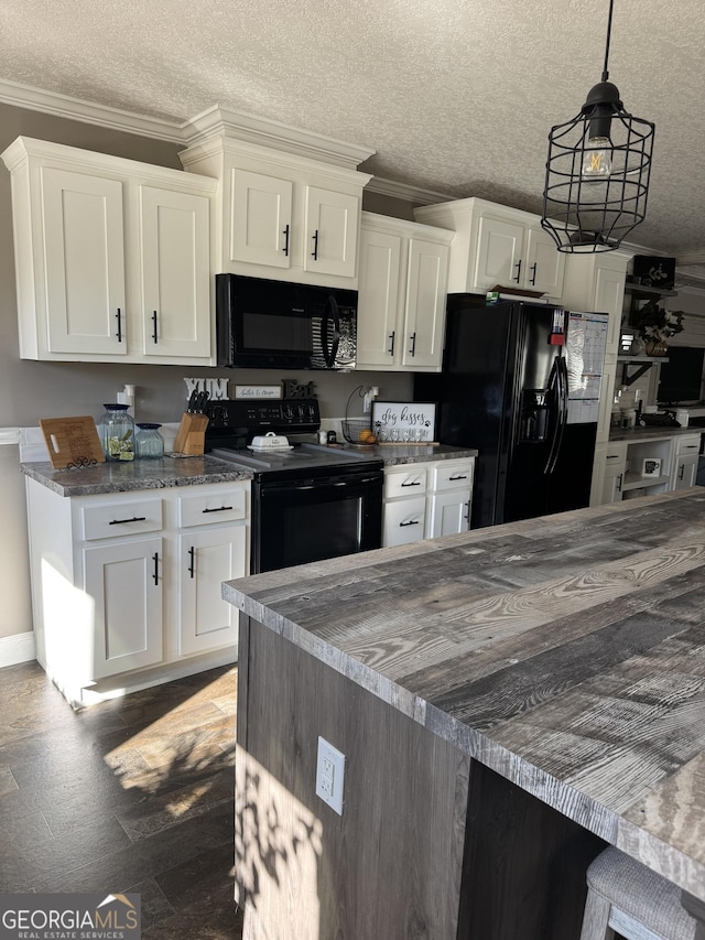 kitchen with black appliances, crown molding, white cabinets, and a textured ceiling