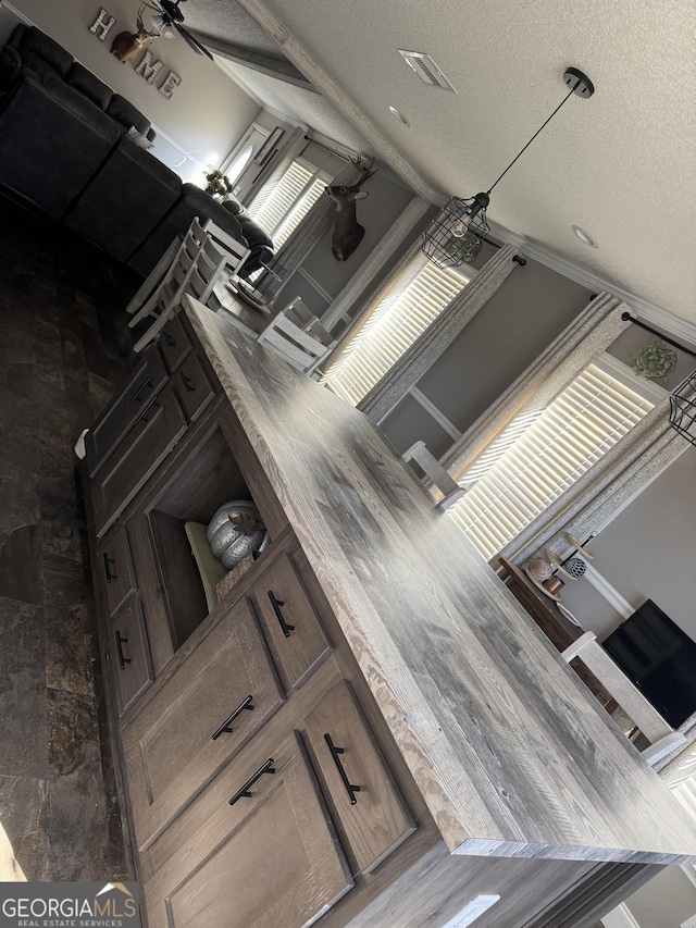 kitchen with a textured ceiling and ceiling fan