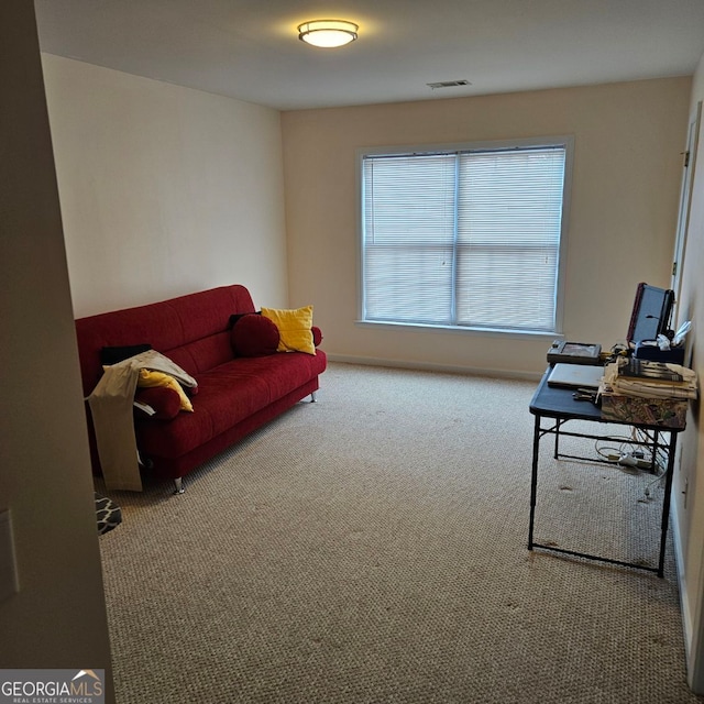 sitting room featuring carpet flooring