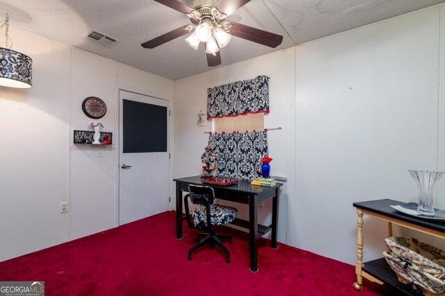 office area with a textured ceiling and ceiling fan