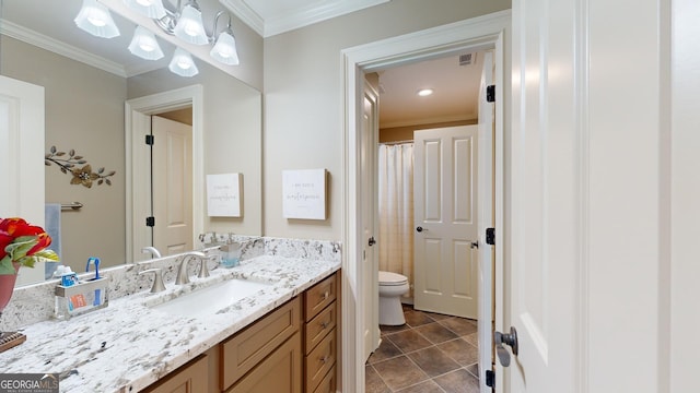 bathroom with tile patterned flooring, vanity, toilet, and ornamental molding