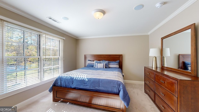 bedroom with light colored carpet, multiple windows, and ornamental molding