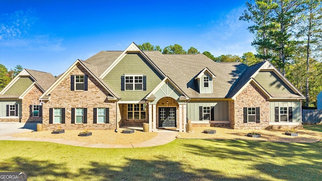 craftsman-style house with a front lawn