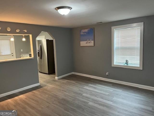 spare room featuring hardwood / wood-style floors