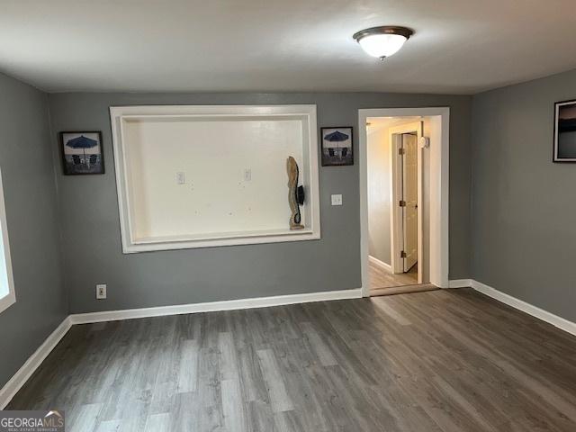 empty room with wood-type flooring