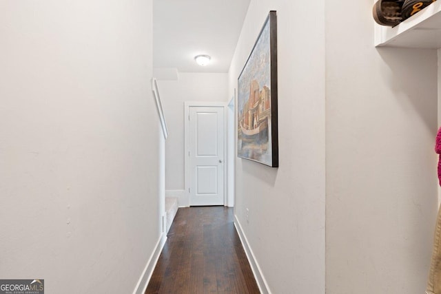 corridor featuring dark hardwood / wood-style floors