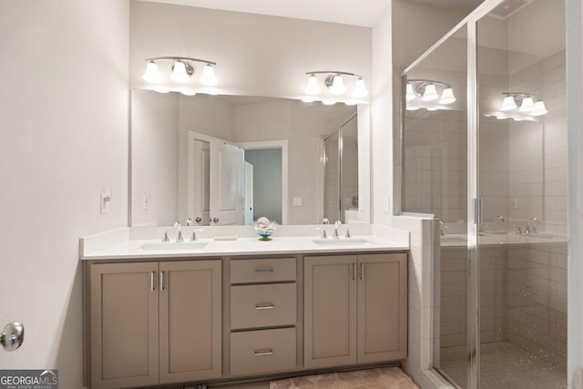 bathroom featuring vanity and a shower with door