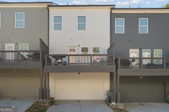 rear view of property with a garage