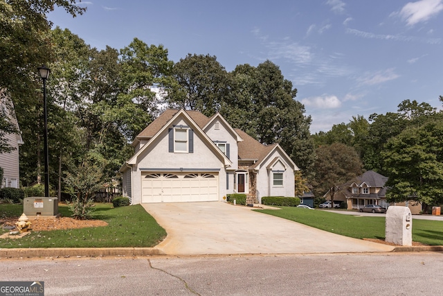 view of front of home featuring a front yard and a garage