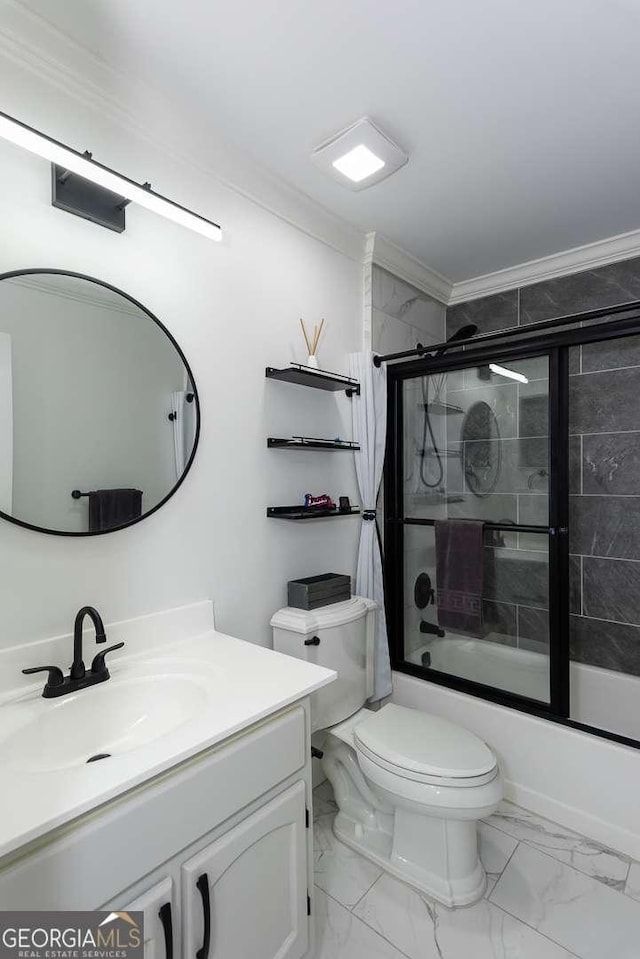 full bathroom with toilet, vanity, combined bath / shower with glass door, and ornamental molding