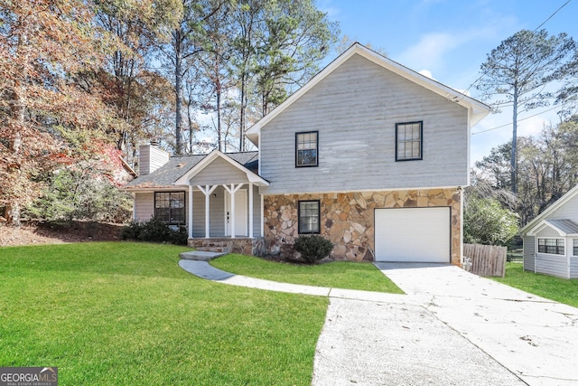 view of front property featuring a front yard and a garage