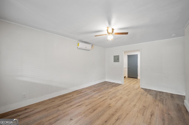 unfurnished room with ceiling fan, a wall unit AC, electric panel, crown molding, and light hardwood / wood-style floors