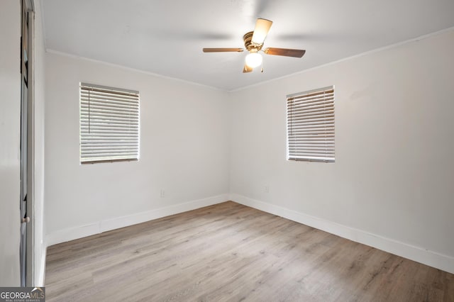 spare room with light hardwood / wood-style floors, ceiling fan, and ornamental molding