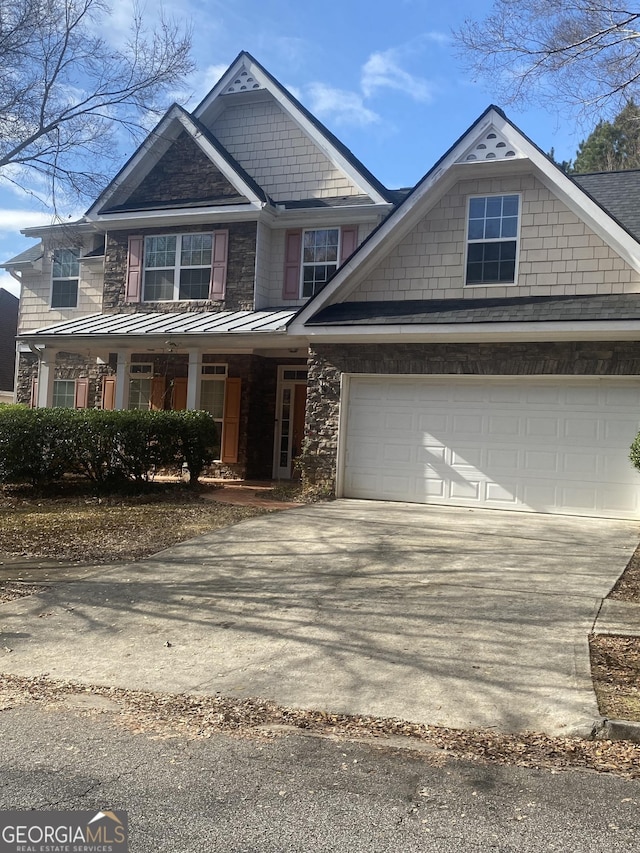 view of front facade with a porch and a garage