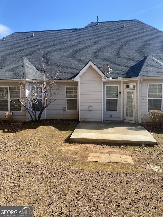 rear view of house with a patio