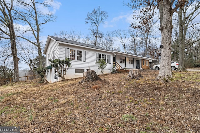 single story home featuring covered porch