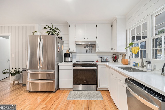 3107 Lotheridge Rd Unit 0, Gainesville, GA 30501 - kitchen with stainless steel appliances, under cabinet range hood, white cabinets, light countertops, and ornamental molding