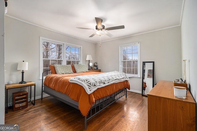 bedroom with ceiling fan, dark hardwood / wood-style floors, and crown molding