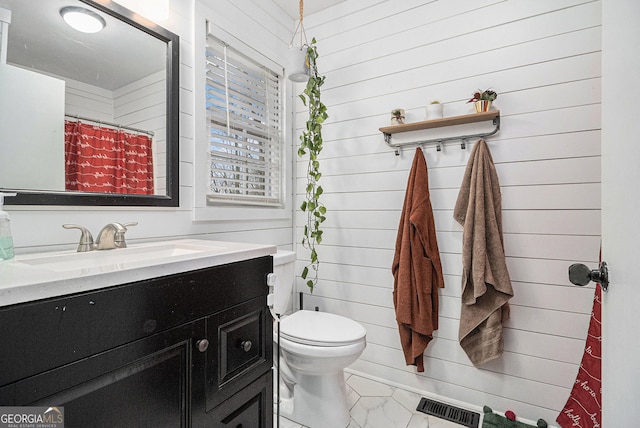 3107 Lotheridge Rd Unit 0, Gainesville, GA 30501 - full bath featuring vanity, toilet, wood walls, and marble look tile flooring
