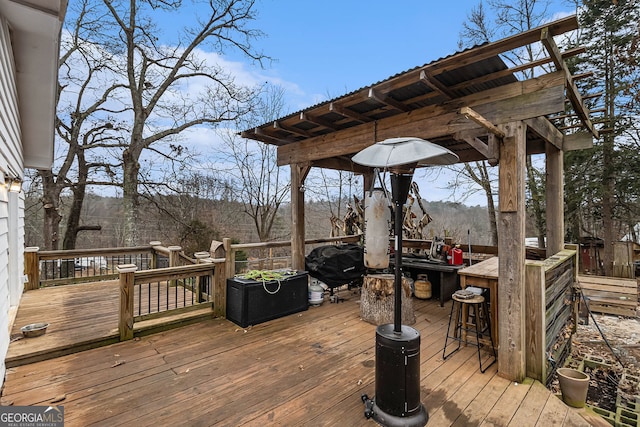 deck with a mountain view and exterior bar