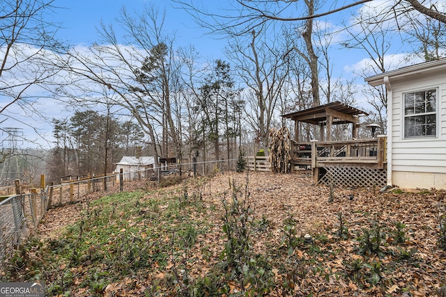 view of yard with a wooden deck