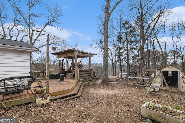 view of yard featuring an outbuilding and a wooden deck