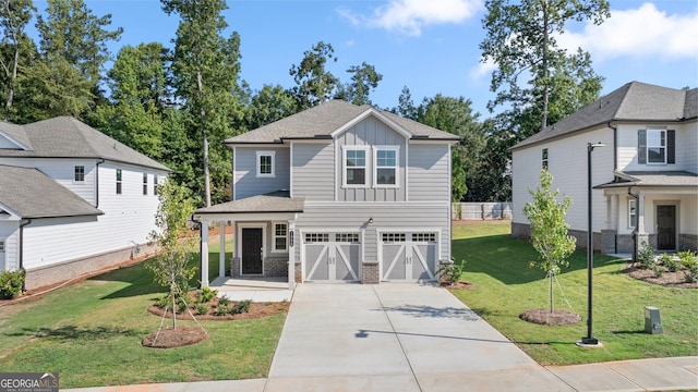 view of front facade featuring a front yard and a garage