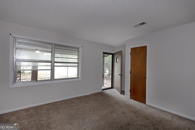 empty room featuring carpet