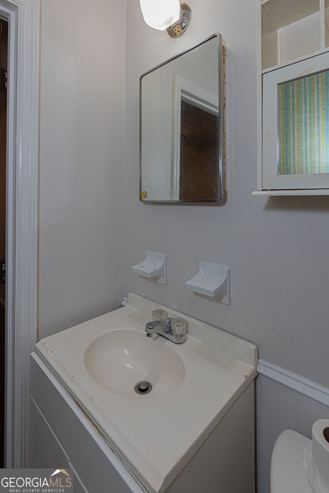 bathroom with vanity and toilet