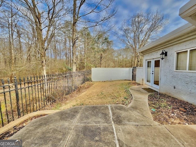 view of yard with french doors