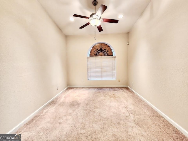 empty room featuring light carpet and ceiling fan