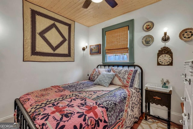 bedroom featuring ceiling fan and wooden ceiling