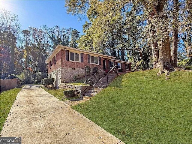 ranch-style home with a front yard