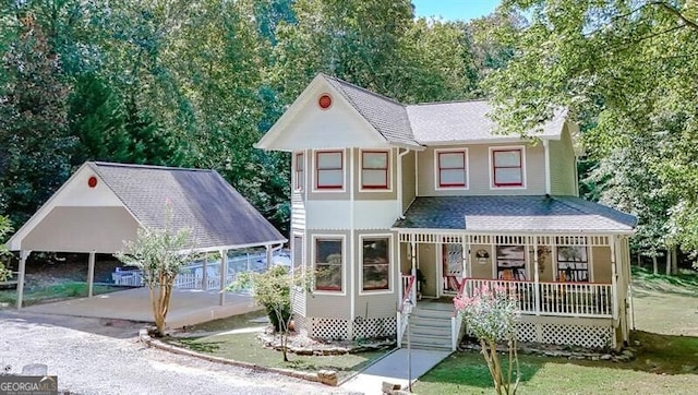 view of front of house with a porch and a carport