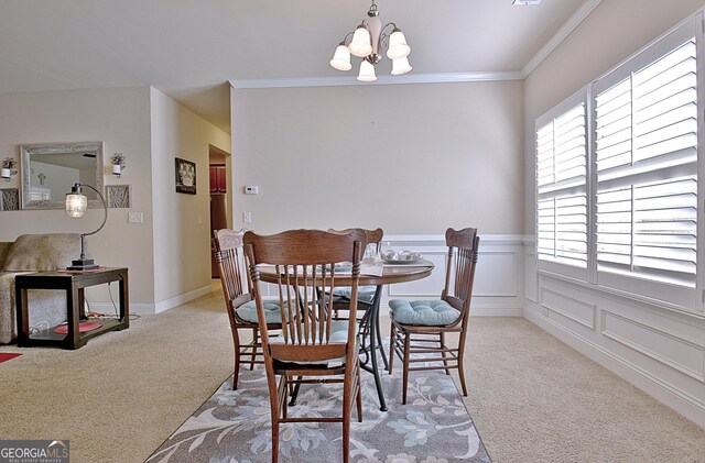 dining space with crown molding, light carpet, and a chandelier