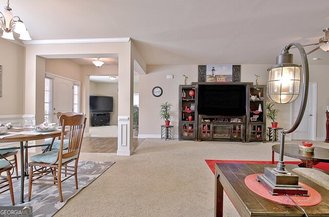 living room featuring carpet flooring and ceiling fan