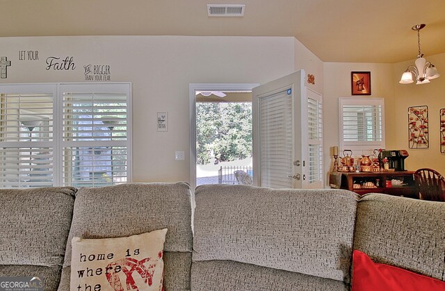 living room featuring an inviting chandelier