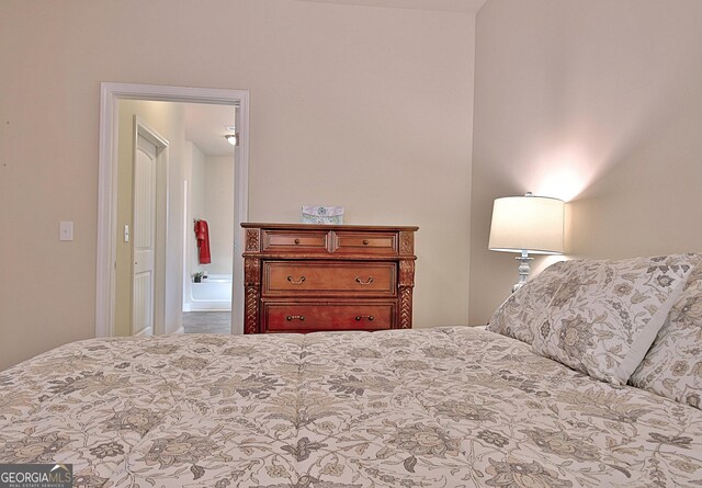 bedroom with ornamental molding, light carpet, ceiling fan, and a tray ceiling