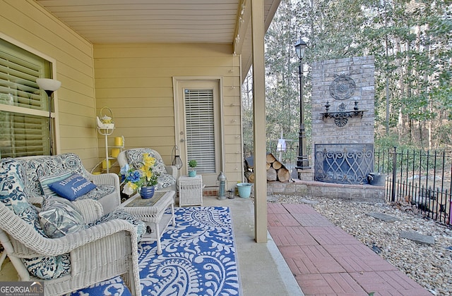 view of patio / terrace featuring an outdoor living space with a fireplace