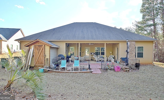 rear view of house with a patio