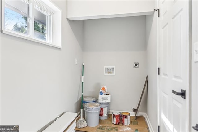 clothes washing area with electric dryer hookup and washer hookup