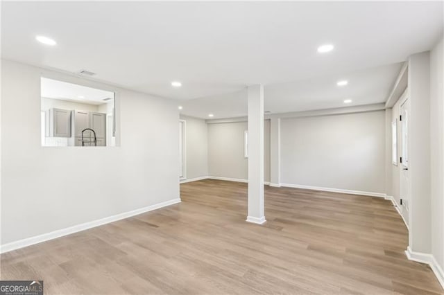 basement with light wood-type flooring