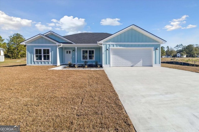 ranch-style house with a front yard and a garage