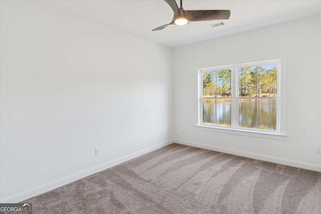 carpeted empty room with ceiling fan