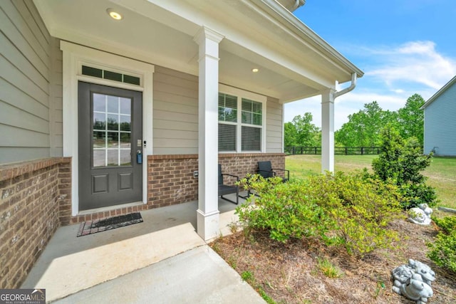 doorway to property featuring covered porch