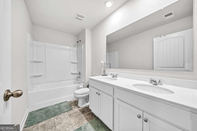 full bathroom featuring toilet, vanity, and bathing tub / shower combination