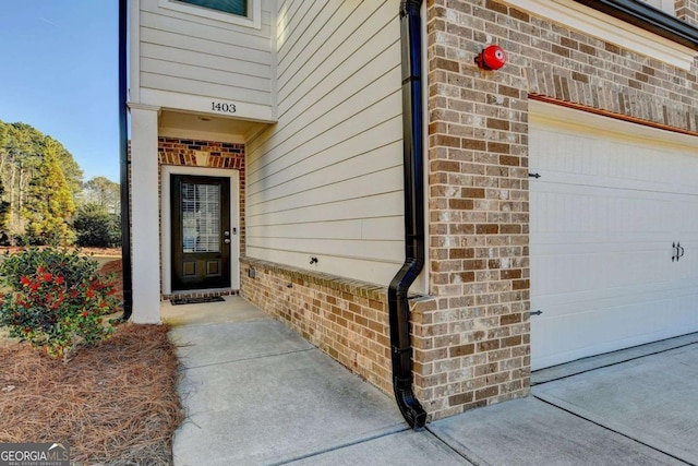 property entrance with a garage