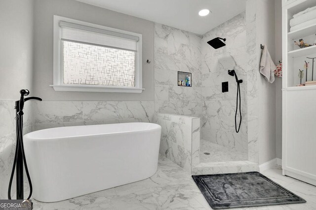 bedroom with ensuite bath, ceiling fan, and hardwood / wood-style flooring